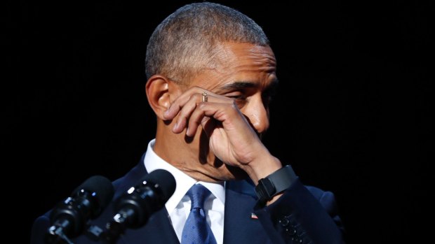 President Barack Obama wipes away tears while speaking during his farewell address.