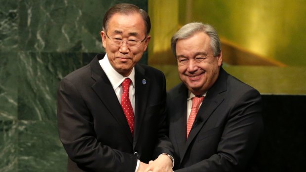 Current Secretary-General Ban Ki-moon, left, clasps hands with Antonio Guterres who will succeed him after Guterres was sworn in at UN headquarters on Monday.