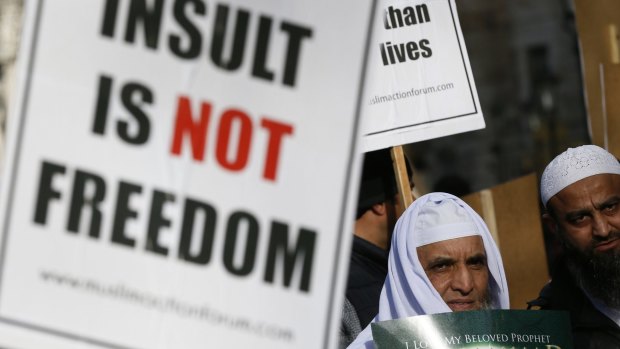 British muslims in London protesting against the depiction of the prophet Muhammad in <i>Charlie Hebdo</i>.