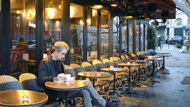 A man takes a seat at La Bonne Biere cafe in Paris during its reopening on Friday. Five people were killed at the cafe on November 13.