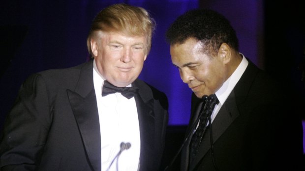 Donald Trump, left, accepts his Muhammad Ali award from Ali at Muhammad Ali's Celebrity Fight Night XIII in 2007. 