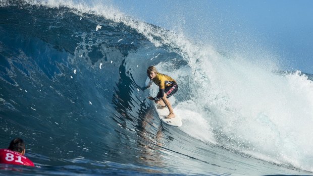 Reigning world champion John John Florence carves down the face at Pipeline.