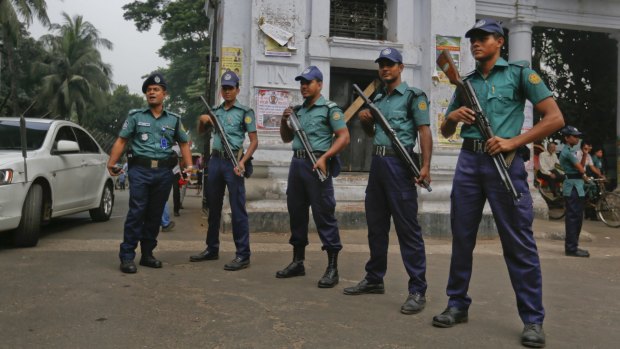 Bangladeshi policemen stand guard in the premises of the Supreme Court in Dhaka on Wednesday.