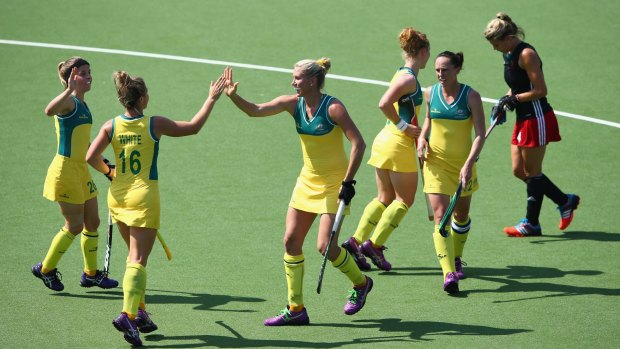 Jodie Kenny (third from left) celebrates after scoring against Wales.