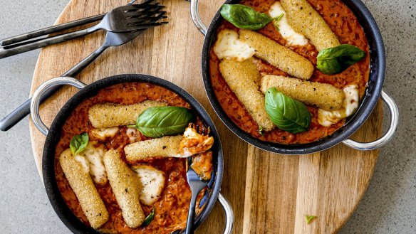 Mozzarella sticks swimming in creamy vodka and tomato sauce.