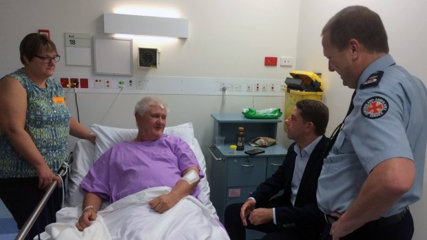 Ambulance Services Minister Cameron Dick and Queensland Ambulance Service Commissioner Russell Bowles visit injured Fraser Island paramedic in hospital on Saturday morning.