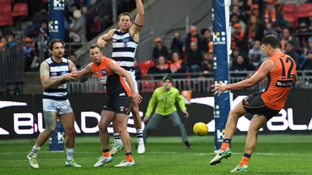 Coaching error: Giants forward Jonathon Patton found himself stranded on the interchange bench shortly after kicking this goal against the Cats.