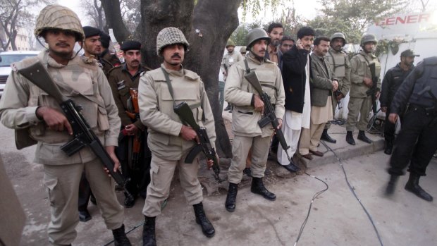 Pakistani troops stand guard after the murder of Punjab's governor Salman Taseer, who criticised the country's blasphemy laws.