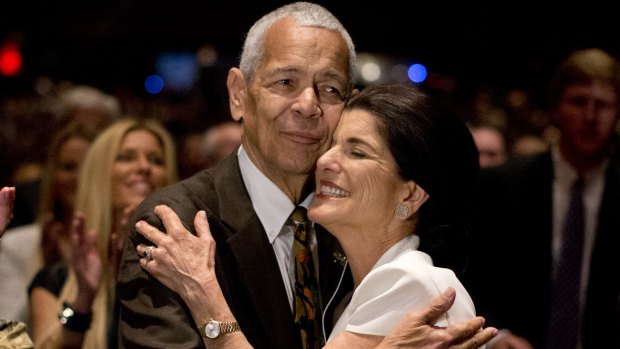 Julian Bond hugs Luci Baines Johnson, the younger daughter of former US President Lyndon Baines Johnson after singing "We Shall Overcome" during the Civil Rights Summit to commemorate the 50th anniversary of the signing of the Civil Rights Act last year.