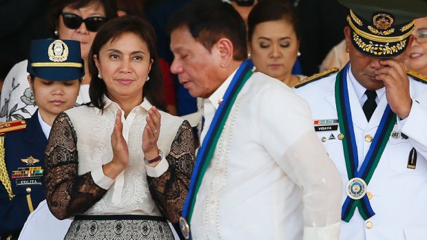 Vice-President Leni Robredo applauds as new Philippines President Rodrigo Duterte walks to address the troops during a ceremony in Quezon City in July.