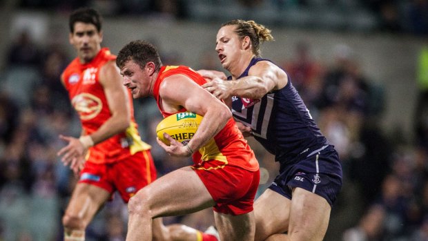Gold Coast will host Fremantle at the new Perth Stadium in round three as Metricon Stadium will be unavailable.