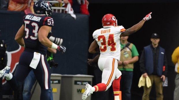 All the way: Kansas City Chiefs running back Knile Davis runs for a touchdown as Houston Texans inside linebacker Max Bullough chases.
