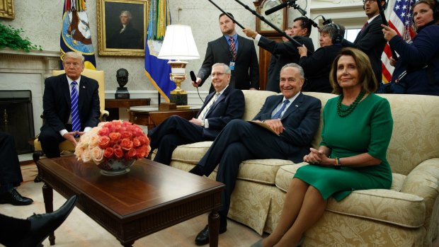 Mr Trump meets (from left) Senate Majority Leader Mitch McConnell, Senate Minority Leader Chuck Schumer and House Minority Leader Nancy Pelosi in the Oval Office.