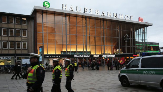 German police patrol in front of the central railway station in Cologne, where retaliatory attacks on immigrants have been reported.