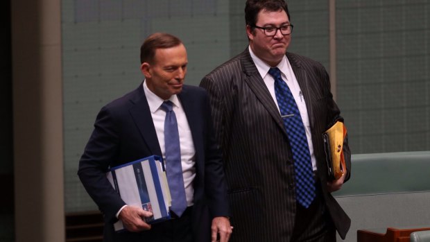 National MP George Christensen, pictured with Prime Minister Tony Abbott, has charged taxpayers for books on climate-change denialism. 