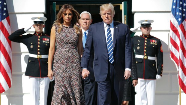 US Vice-President Mike Pence walks right behind his commander-in-chief, President Donald Trump and first lady Melania Trump.