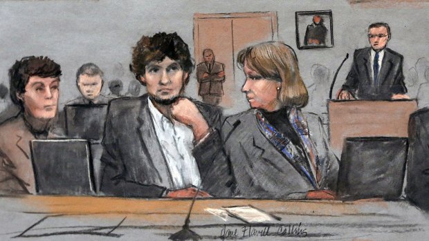 A courtroom sketch shows Dzhokhar Tsarnaev between defense attorneys Miriam Conrad, left, and Judy Clarke, right, during his federal death penalty trial. 