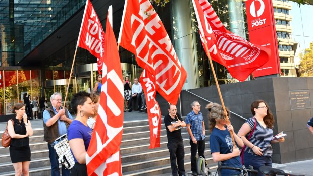 Injured workers rallied outside the Australia Post headquarters as Australia Post's outgoing CEO was grilled by a Senate estimates committee.