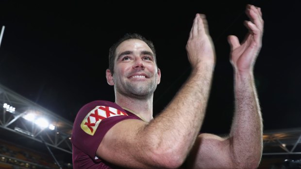 Winners are grinners: Cameron Smith salutes the crowd after Game Two. 
