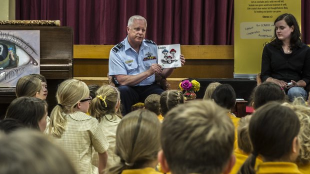 Teen author Jessica Love and Chief of Defence Force Air Chief Marshal Mark Binskin read Soon to pupils at Campbell Primary School.