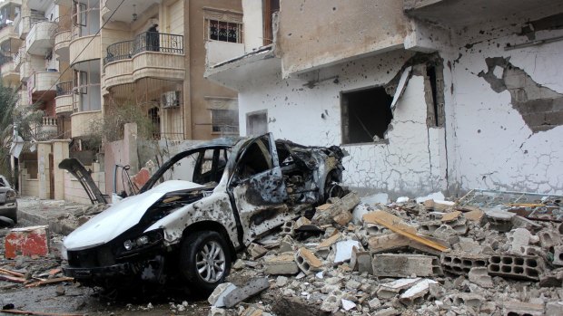The wreckage of a car following an alleged Syrian regime air strike on Raqqa, the headquarters of the so-called Islamic State's "caliphate".