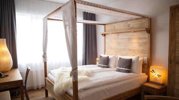 The linen on the four-poster bed is 100 per cent white cotton, and there are two down duvets -- one for each side of the bed!