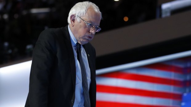 Bernie Sanders leaves the stage after speaking on the first day of the Democratic convention in Philadelphia.