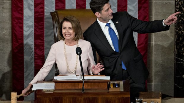 US House Speaker Republican Paul Ryan, right, and House Minority Leader Democrat Nancy Pelosi after being re-elected in the House Chamber on Tuesday.