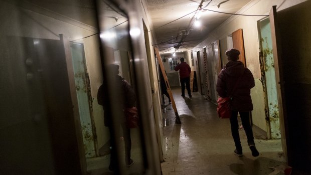 Intrepid visitors explore Mike Parr's Asylum.
 
