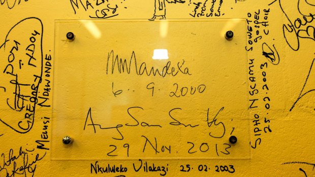 The wall of signatures at the ANU School of Music, seen here in 2013, includes some notable people, including Nelson Mandela and Aung San Suu Kyi.