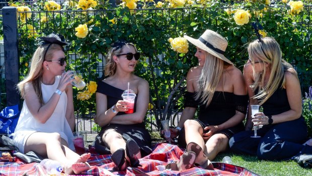 Crowds enjoying a perfect day at the track during the Spring Racing Carnival.