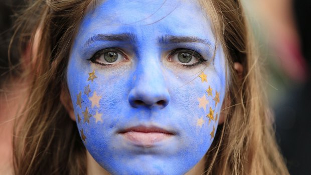 A "Remain" supporter, her face painted to resemble the EU flag, protests in London on July 2.