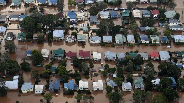 Floodwaters from the Wilsons River engulf homes in central Lismore.