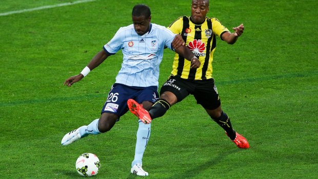 Calmness under pressure: Jacques Faty holds off Roly Bonevacia in Wellington.