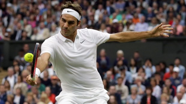 Maintaining focus throughout: Roger Federer returns to Marcus Willis of Britain.