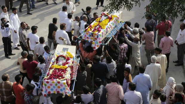 People carry coffins of two girls who lost their lives in the Lahore park attack on Easter Sunday.