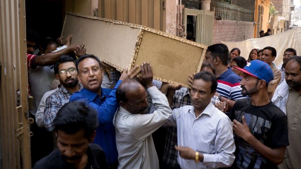 People carry the coffin of Pakistani Christian boy Sahil Pervez for his burial in Lahore on Monday.