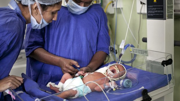 A newborn baby at the Akanksha Clinic, in Anand, India which has now outlawed commercial surrogacy.