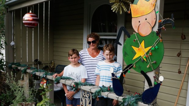 Ant menace: Pene, with Logan, 11, and Hayden, 10, at their Botany home, which is in Saturday's search zone.