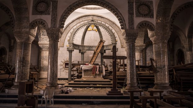 The ransacked sanctuary at St George's church in Qaraqosh, Iraq. Many churches in the region  lay desecrated but not totally destroyed.
