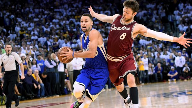 Shadowing: Cleveland's Matthew Dellavedova guards Golden State star Stephen Curry during their NBA game at ORACLE Arena on December 25 in Oakland.