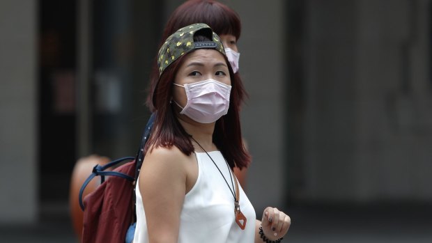 Women wear masks to protect against the MERS virus in Seoul in 2015.