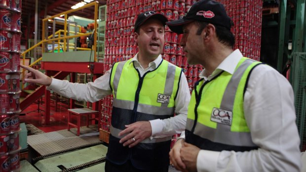 Trade Minister Steve Ciobo, left, visits a Coca-Cola plant in West Java, Indonesia, in December.