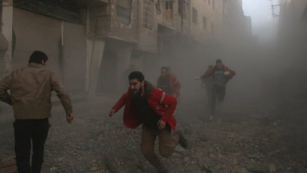 Ongoing: People run as Assad Regime forces carry out airstrikes on Duma, Damascus, on February 15.