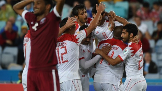 Party time: Sayed Ahmaed Jaafar scores  for Bahrain against Qatar at Stadium Australia.
