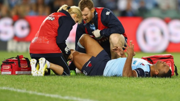 Down and out: Kurtley Beale was stretchered off in the opening minute.