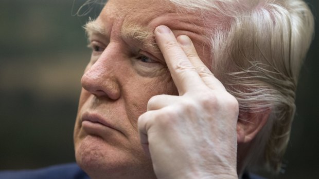 Donald Trump listens during a meeting on healthcare on Monday.