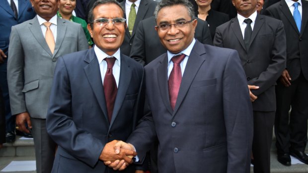 East Timor's new Prime Minister Rui Araujo (right) shakes hands with President Taur Matan Ruak after Dr Araujo's swearing-in in Dili this week.