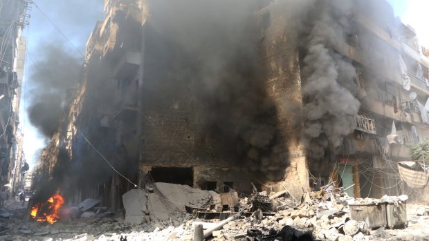 Smoke rises from an Aleppo building after an air strike last month.