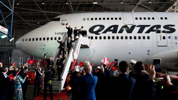 The flight crew boards the last 747 during its farewell ceremony at Sydney Airport.